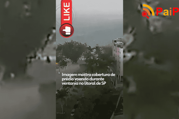 Imagem mostra cobertura de prédio voando durante ventania no litoral de SP