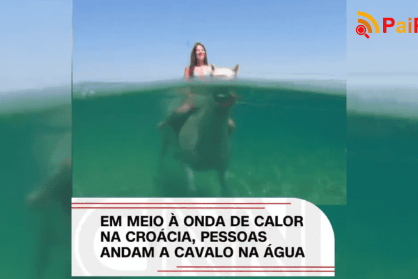 Em meio à onda de calor na Croácia, pessoas andam a cavalo na água